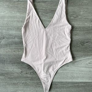 Nude V Neck bodysuit with thong back. Babaton brand.